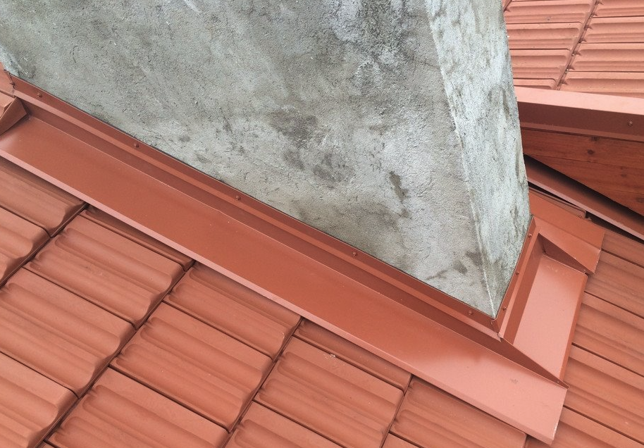 Chimney flashing installed on terracotta roof