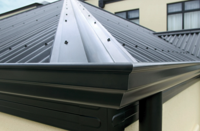 Ridge capping on dark standing seam roof