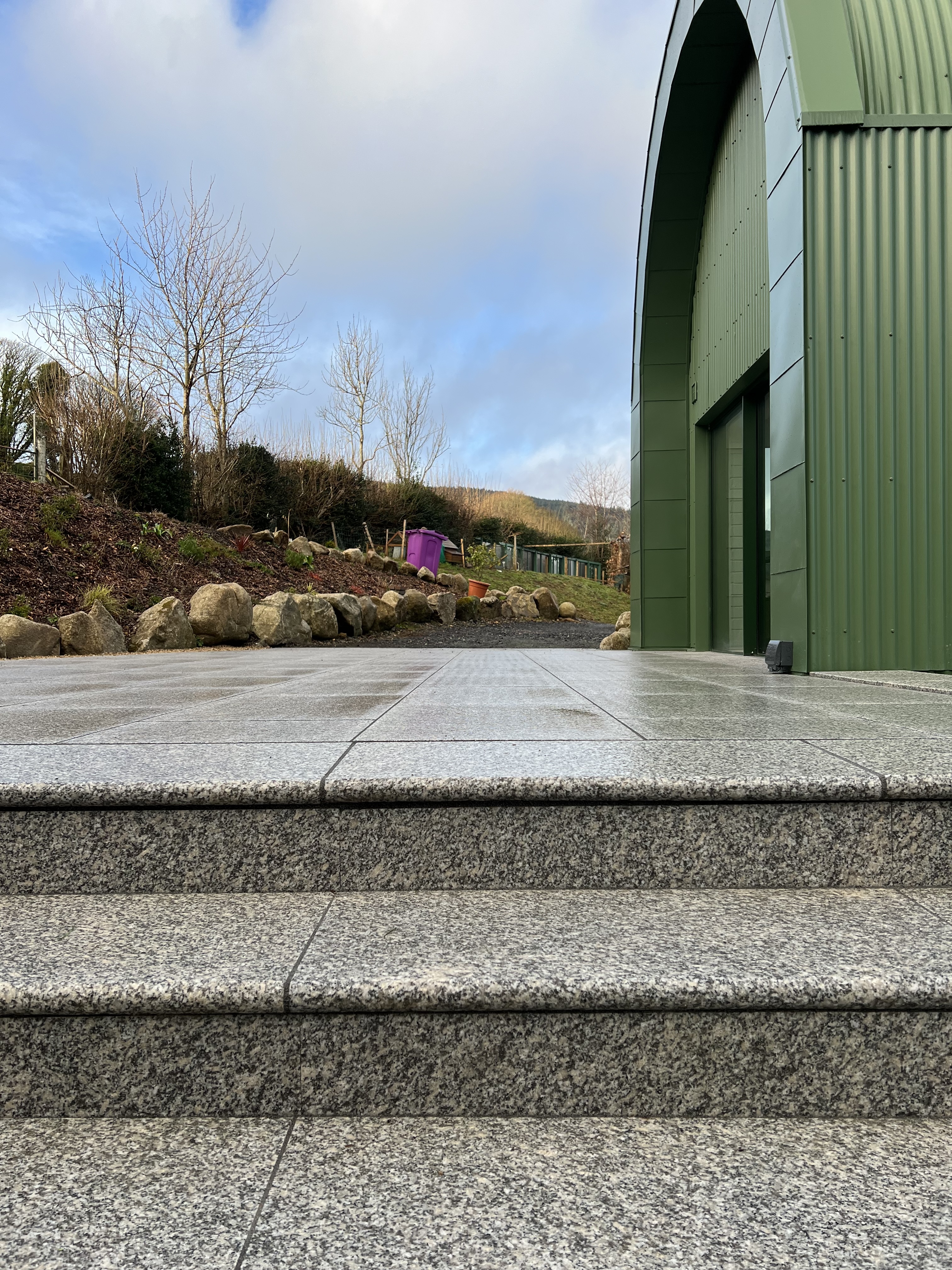 Contemporary barn conversion with dark corrugated cladding